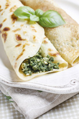 Mediterranean cuisine: crepes stuffed with cheese and spinach