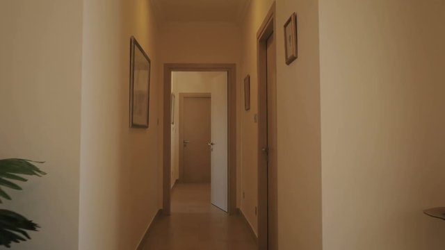 Long corridor with wooden doors
