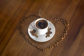 white cup hot coffee and scattered coffee grains
