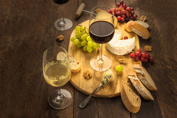 Wine and cheese tasting with bread and grapes