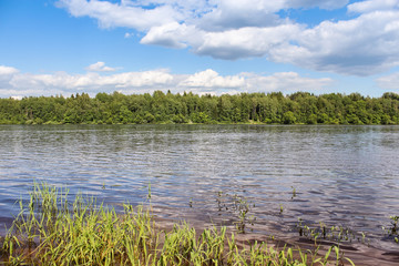 White clouds over the river.