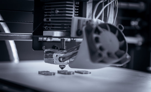 Electronic three dimensional plastic printer during work , 3D , printing.