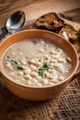 Mushroom soup on a wooden table.