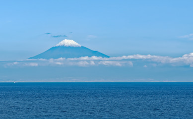Sea approach to Shimizu, Japan with the sunlit snow capped peak of Mt. Fuji gleaming in the background