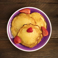 Freshly baked homemade pancakes with fresh fruit