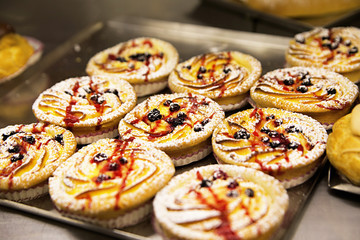 Sweet pastry with jam in the shop window