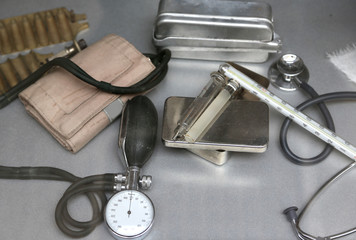 old medical Instruments  with a measuring pressure and glass syr
