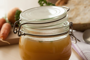 Bone broth made from chicken in a glass jar