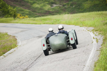 Two friends on vintage car