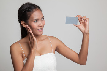 Young Asian woman happy with  blank card.