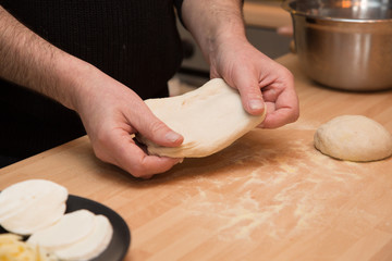 Making homemade pizza with fresh ingredients