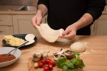 Making homemade pizza with fresh ingredients