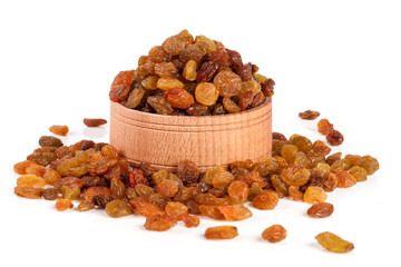 raisins in a wooden bowl isolated on white background. Selective focus