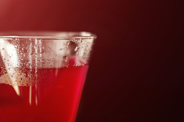 Glass of Red Alcoholic Cocktail on Dark Background