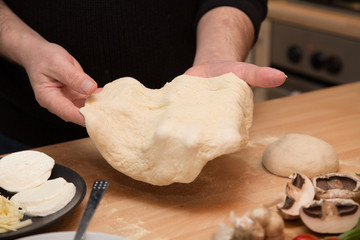 Making homemade pizza with fresh ingredients