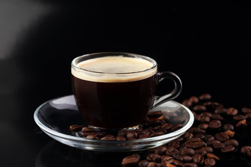Coffee cup and coffee beans on table
