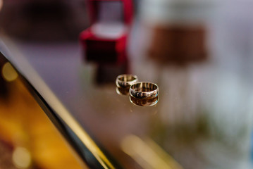 Wedding rings on a glass surface