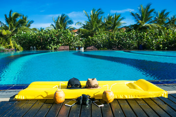 Orange mattress in a pool