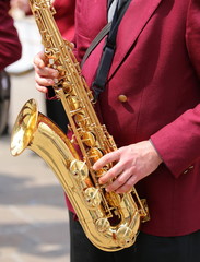 hand of player and the golden saxophone