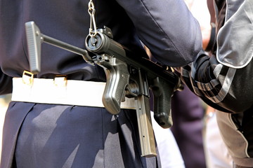 police officer with machine gun controls the drug dealer