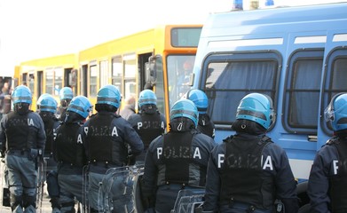 riot police while escorting the bus to the stadium