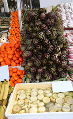 greengrocer with banana artichoke hearts and mandarins and other