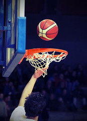 basketball player during the crushing of the basket with the bas