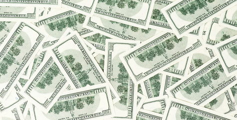 Background from scattered dollar banknotes as abstract seamless.