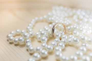 Wedding ring on pearl beads