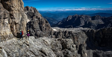 Two climbers on Via Ferrata with great view, Dolomites Italy