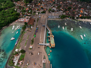 Aerial shot of the town of Padang Bai with marine port. Bali, Indonesia