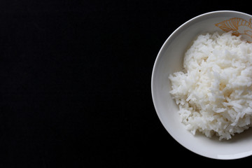 Rice cooked in bowl on white background