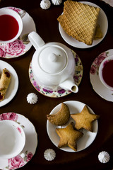 Karkade with sweets. Traditional family tea for three at a round table