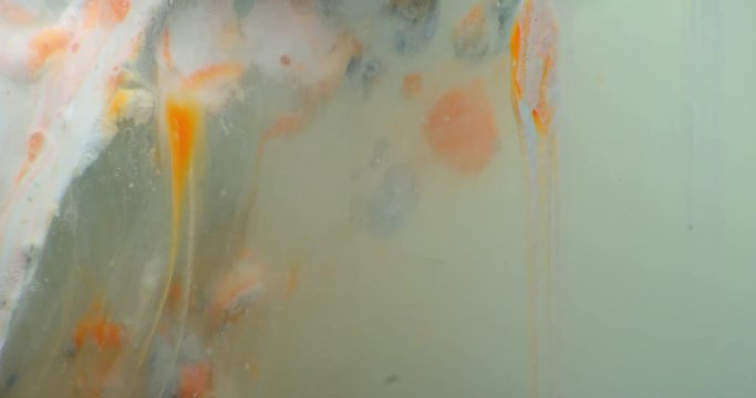 Abstract macro composition of colored acrylic in liquids. 4k. Shot on RED.

