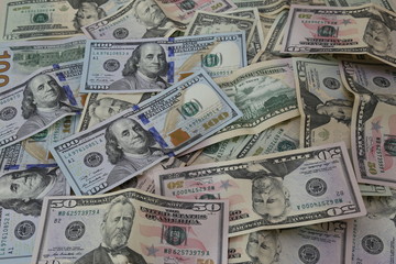 Pile of United States of America Dollar banknotes. Different American Dollar bills banknotes piled together.