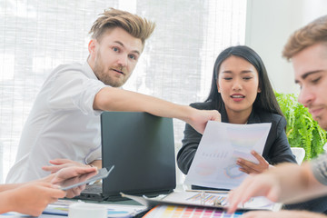 handsome young businessman is talking to a businesswoman.