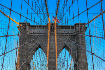 New York City - American flag flying on the Brooklyn Bridge