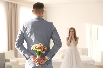 Happy wedding couple at home