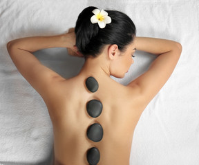 Beautiful young woman in spa salon