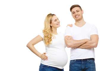 Fototapeta premium Young pregnant happy woman posing with her handsome husband