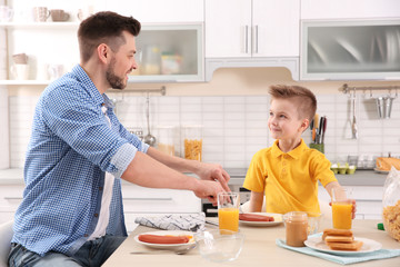 Dad and son having lunch at home