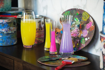 vase with colored water. palette. creative mood. artistic atmosphere