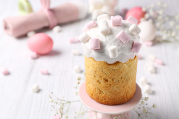 Delicious Easter cake decorated with marshmallow on light table