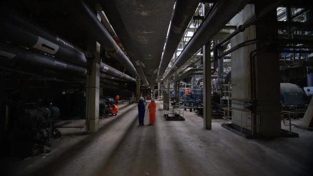  Engineer in power station carrying out maintenance & checking the machinery