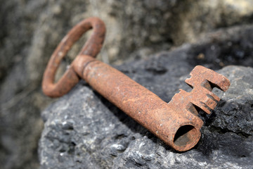 very old door key in rusty iron