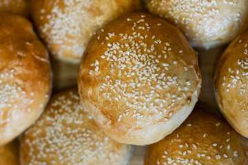 Background of the buns with sesame seeds