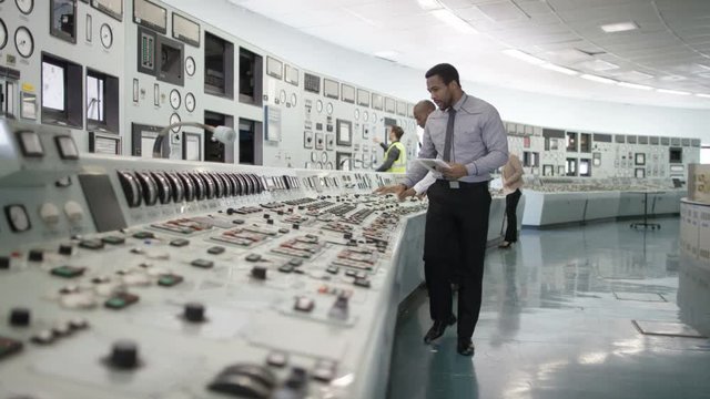  Time lapse of busy workers in power plant control room