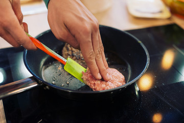 Chef cooks .patty