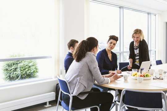Sweden, Young people sharing ideas during board meeting