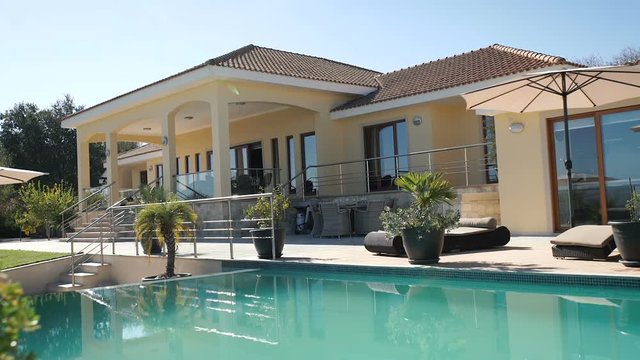 Girl is walking along the balcony of the villa
